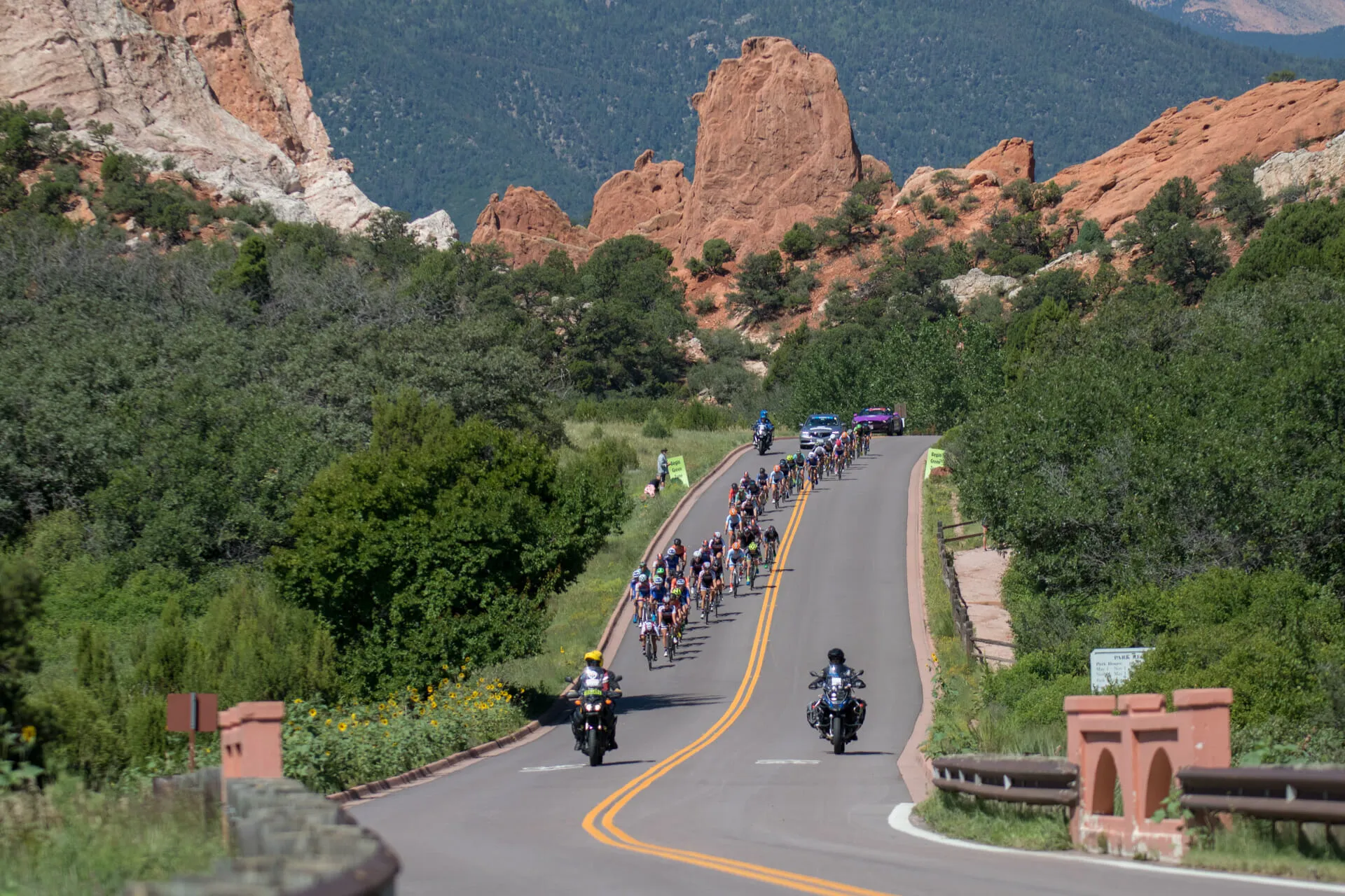 Cyclist riding hard on an open road