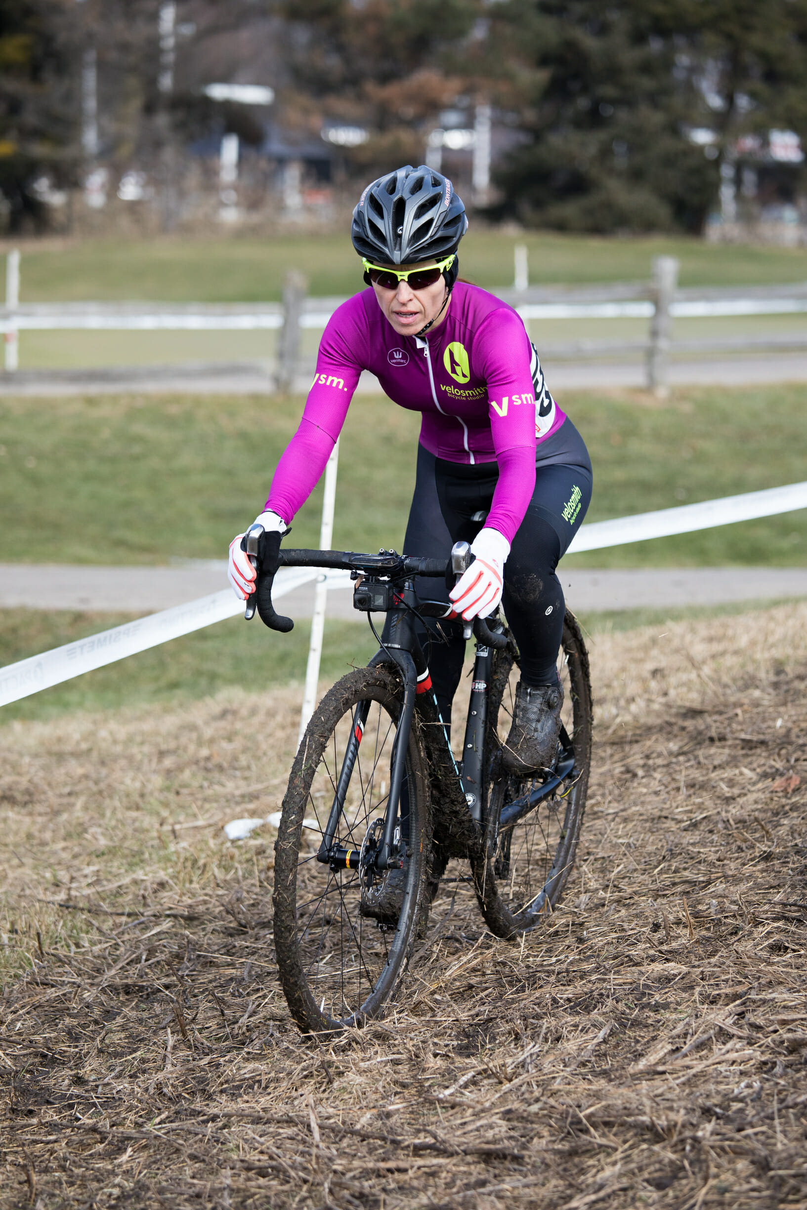Theia Friestedt racing cyclocross on very dry grass mixed with mud on Trek Boone